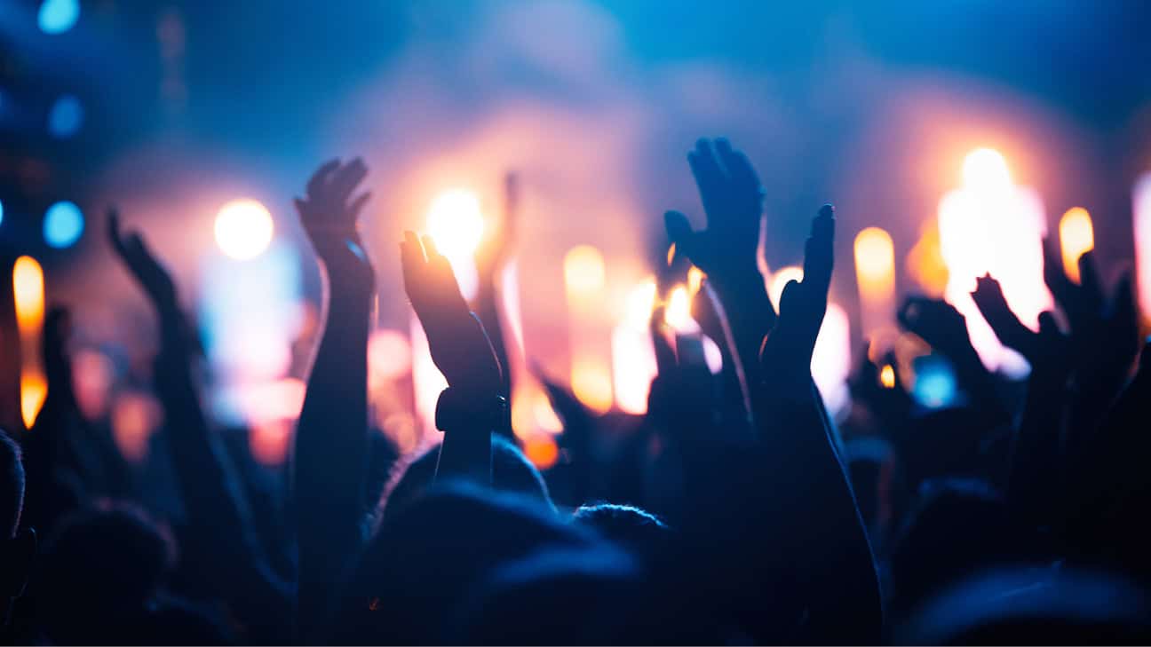 A crowd's hands up at a concert.